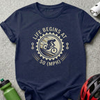 Navy t-shirt with "LIFE BEGINS AT 50 (MPH)" graphic and cyclist silhouette.