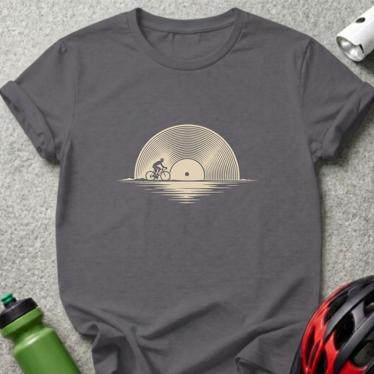 Dark gray t-shirt featuring a beige graphic of a cyclist riding in front of a vinyl record.