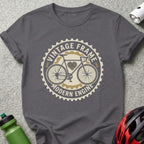 Dark t-shirt with a circular "Vintage Frame Modern Engine" bicycle graphic.