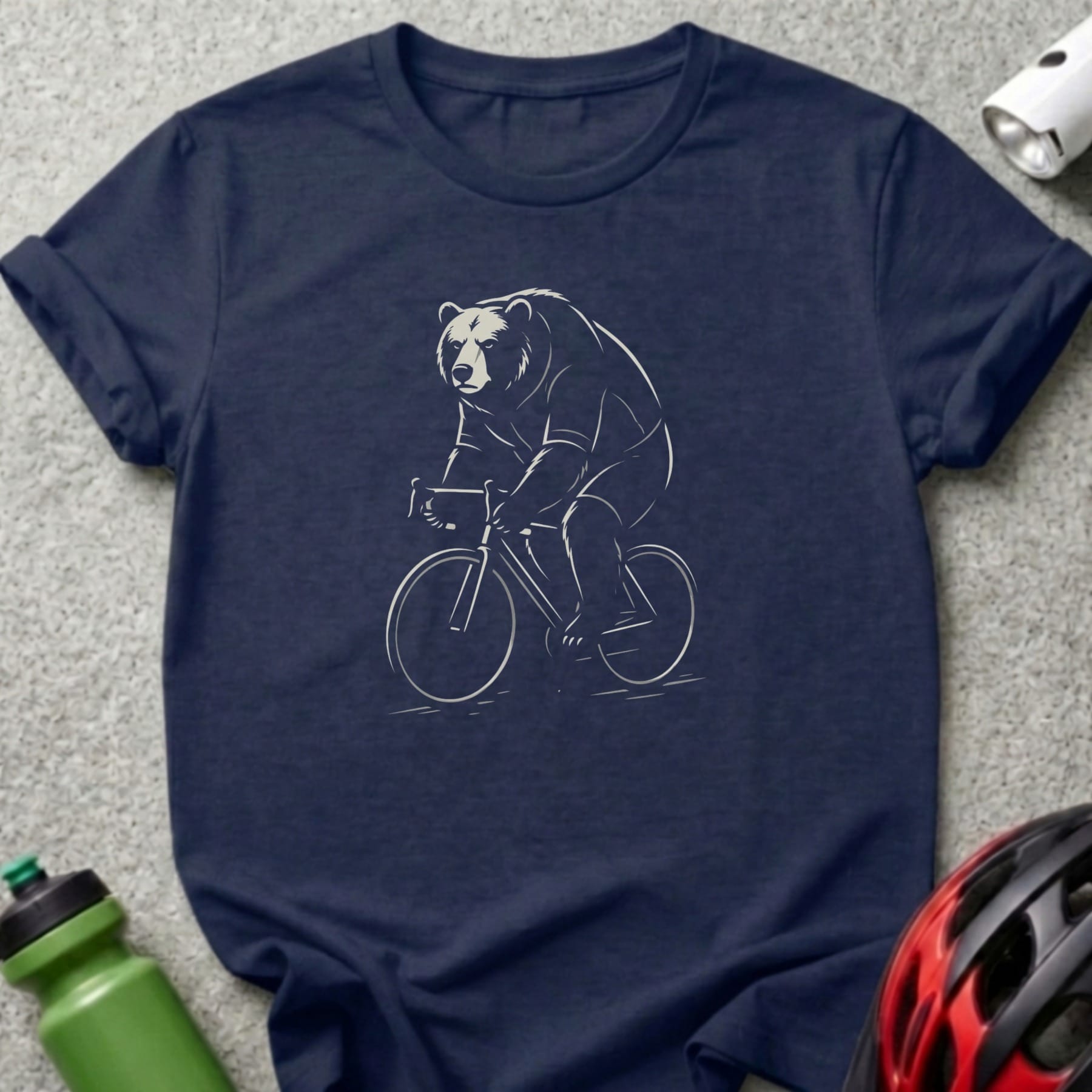Navy t-shirt with a white line drawing of a bear riding a bicycle.