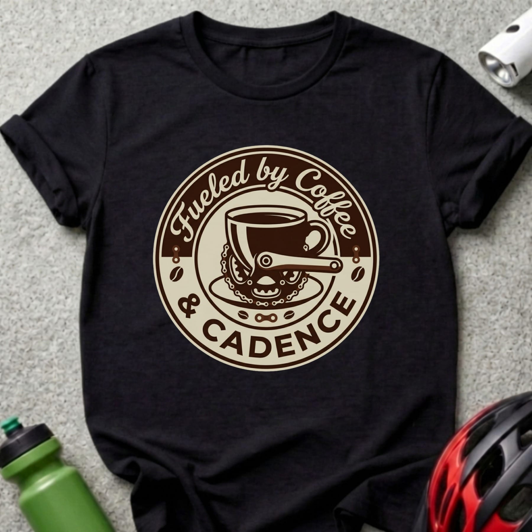 T-shirt with "Fueled by Coffee & Cadence" text and coffee cup and bicycle chain graphic.