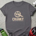 Grey t-shirt with "CRANKY EVEN IN THE AFTERLIFE" and bicycle crank graphic.