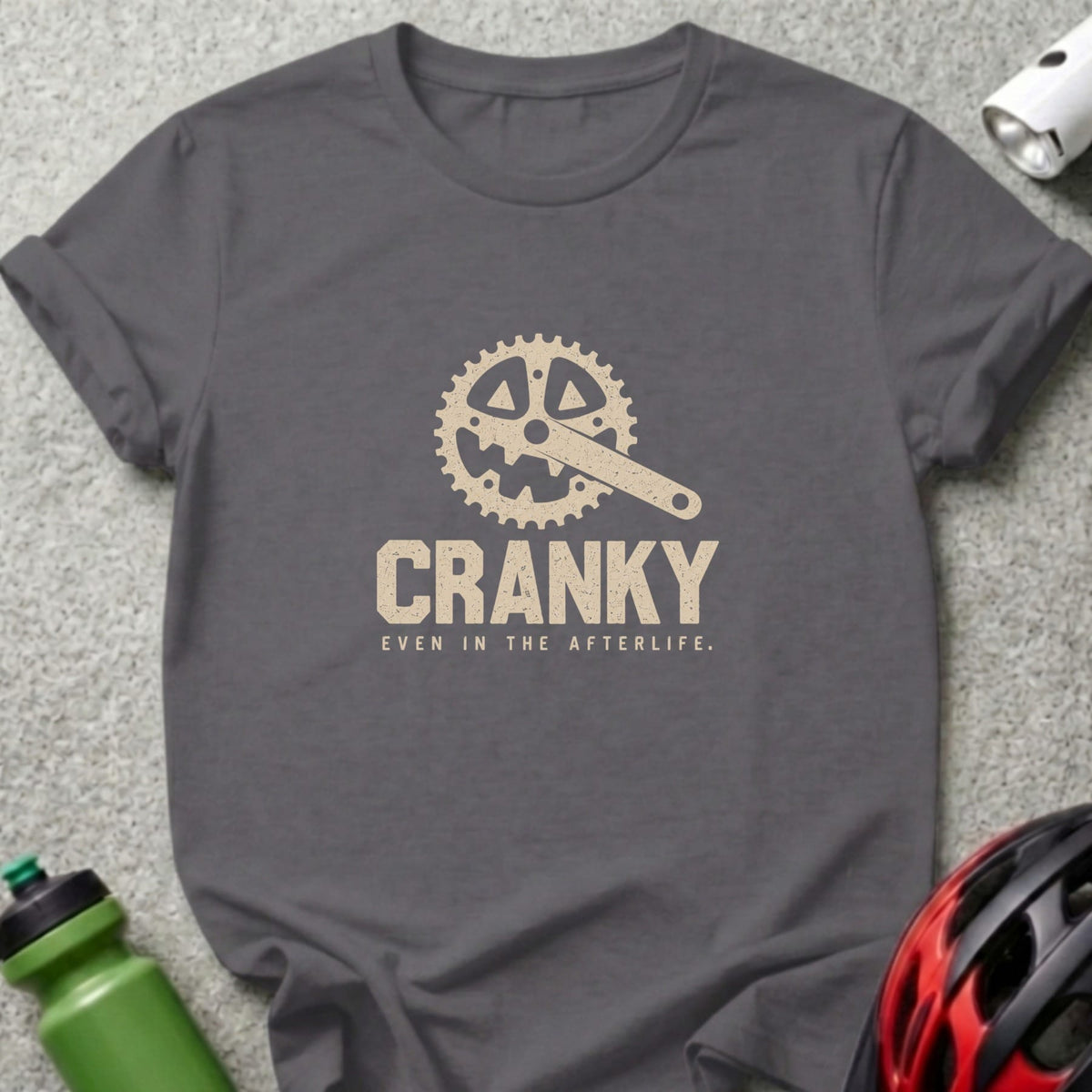Grey t-shirt with "CRANKY EVEN IN THE AFTERLIFE" and bicycle crank graphic.
