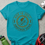 Teal t-shirt with "Age is just another gear" bicycle graphic.