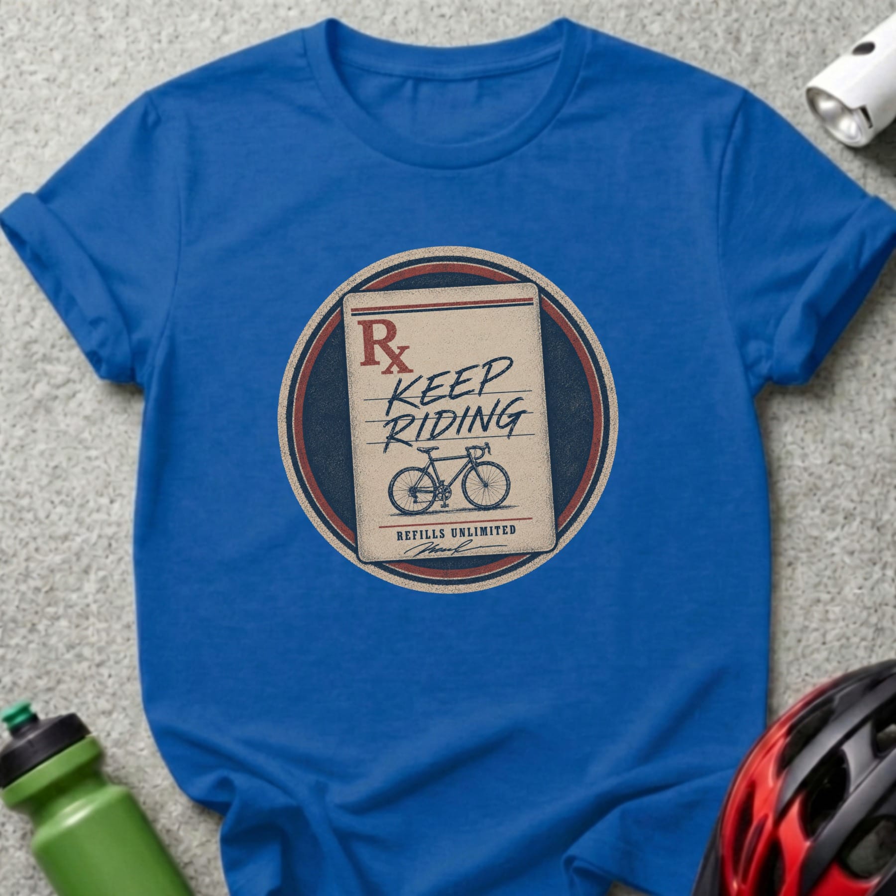 Blue t-shirt with "Rx Keep Riding Refills Unlimited" prescription design.
