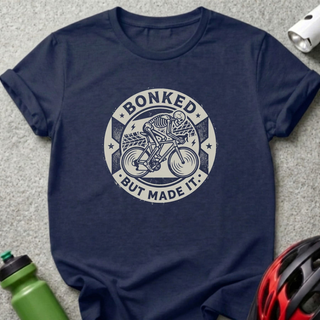 Navy t-shirt with "Bonked but made it" text and skeleton cyclist graphic.