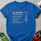 Royal blue t-shirt with white text and road bike illustration about uphill cycling.