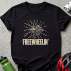A black t-shirt featuring a bicycle wheel graphic and the text Freewheelin'.