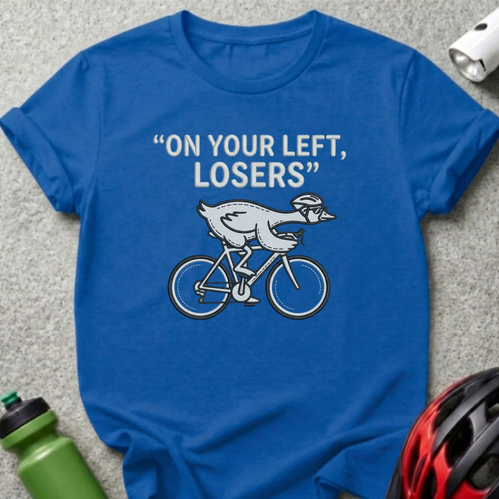 Blue t-shirt with cartoon goose in helmet riding a bicycle, text "ON YOUR LEFT, LOSERS".