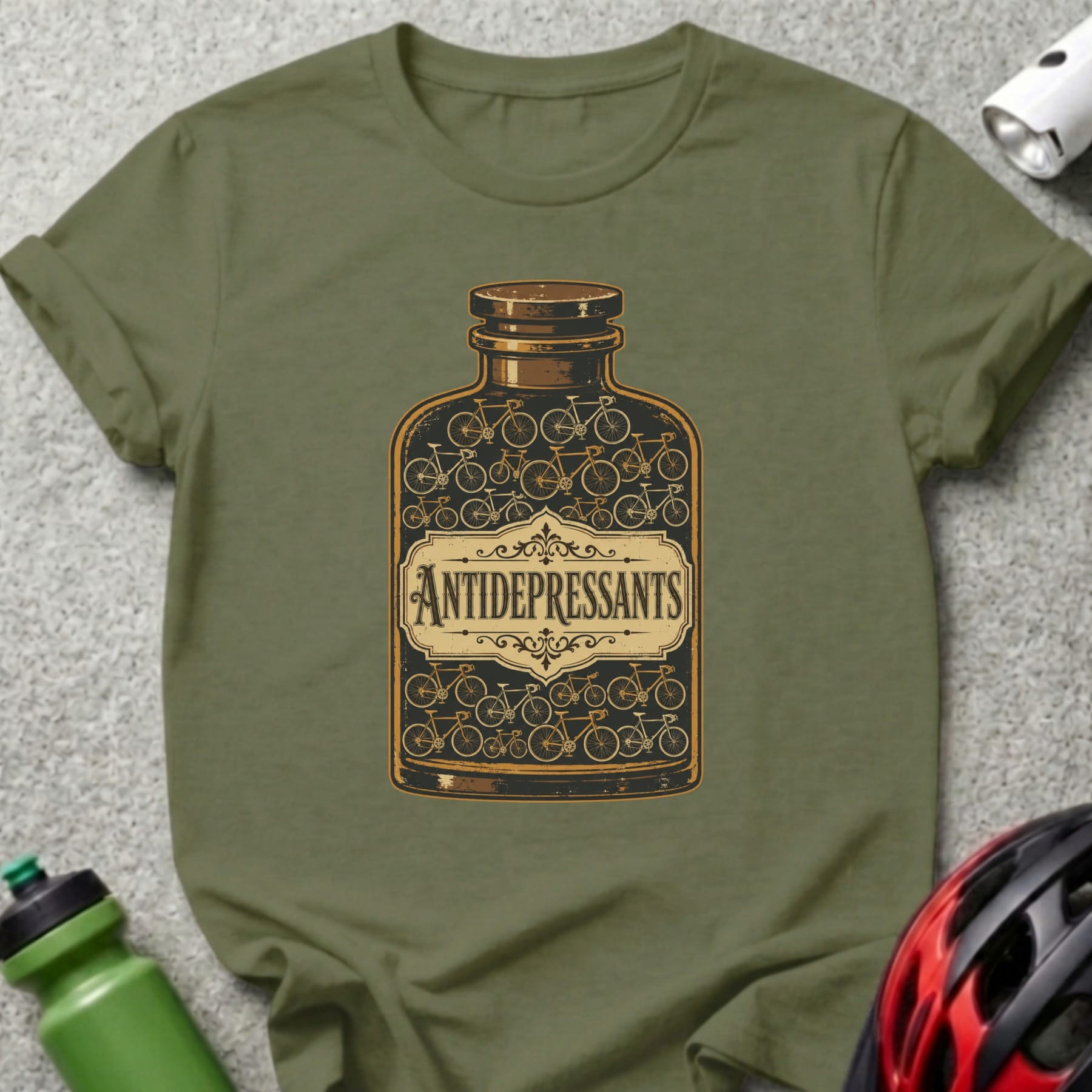 Olive green t-shirt with bottle labeled "Antidepressants" filled with bicycles.