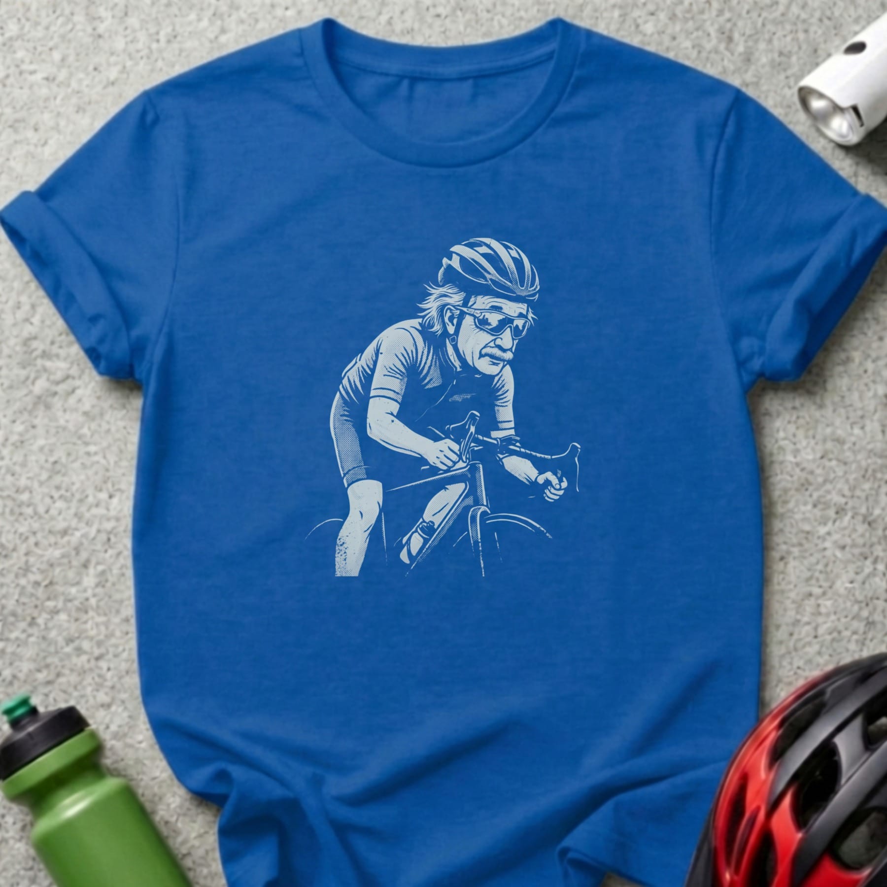 Blue t-shirt with illustration of an older man cycling in a helmet.