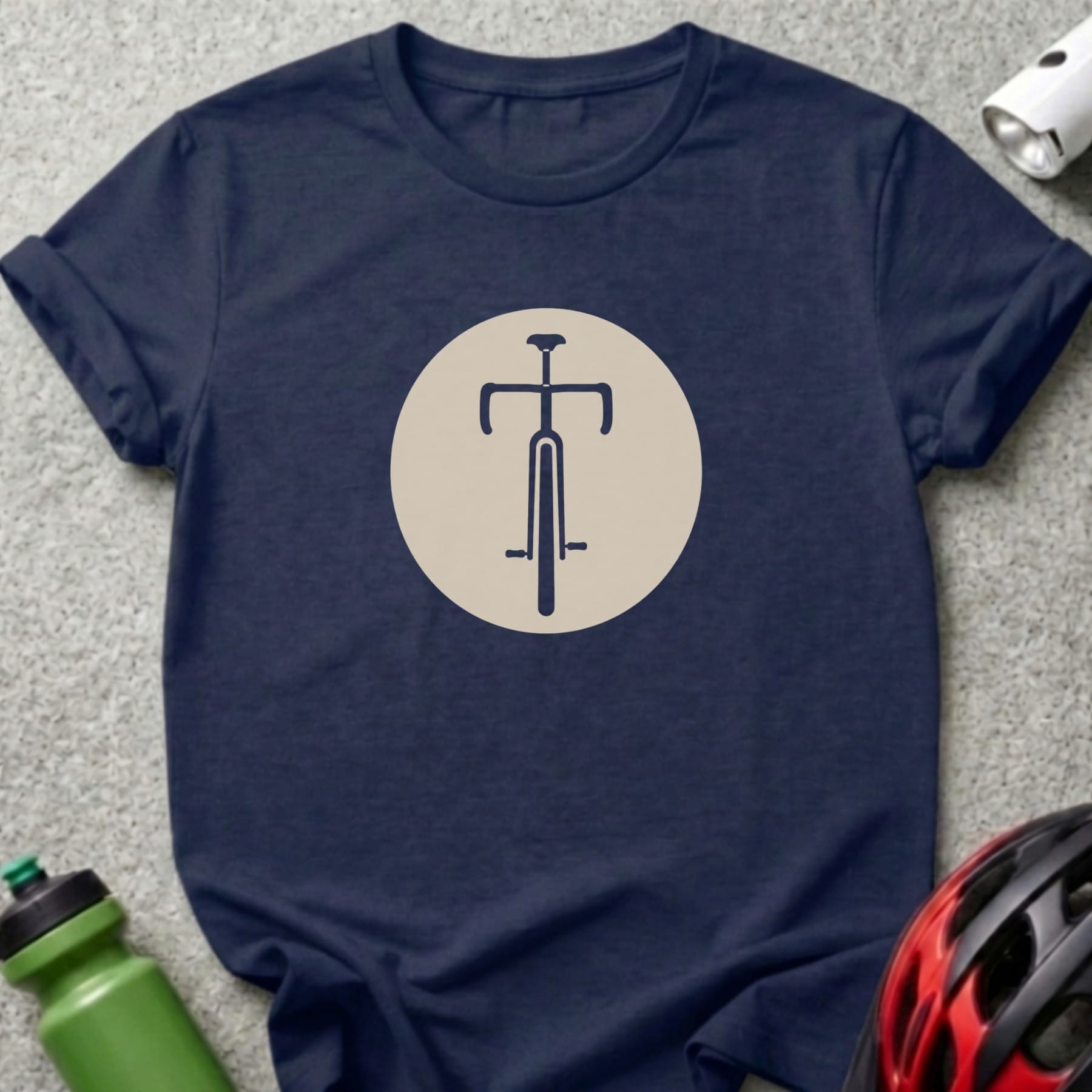 Navy t-shirt with a minimalist dark blue bicycle graphic inside a beige circle.