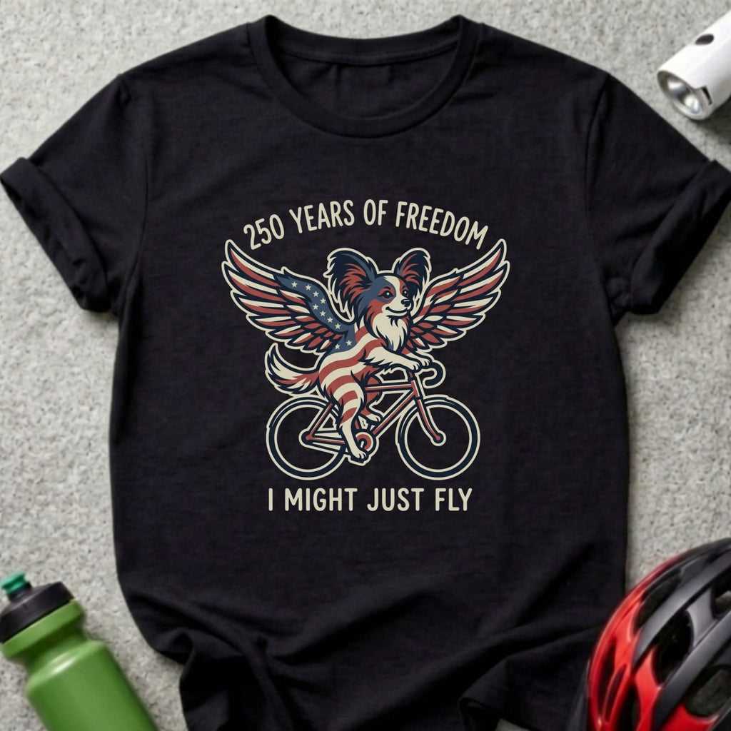Black t-shirt with a dog wearing an American flag cape on a bicycle.