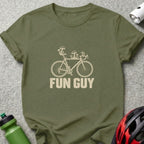 An olive green t-shirt featuring a beige graphic of a bicycle with mushrooms and the text "FUN GUY".
