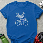 A blue crewneck t-shirt features a white graphic of a bird riding a bicycle on the chest.