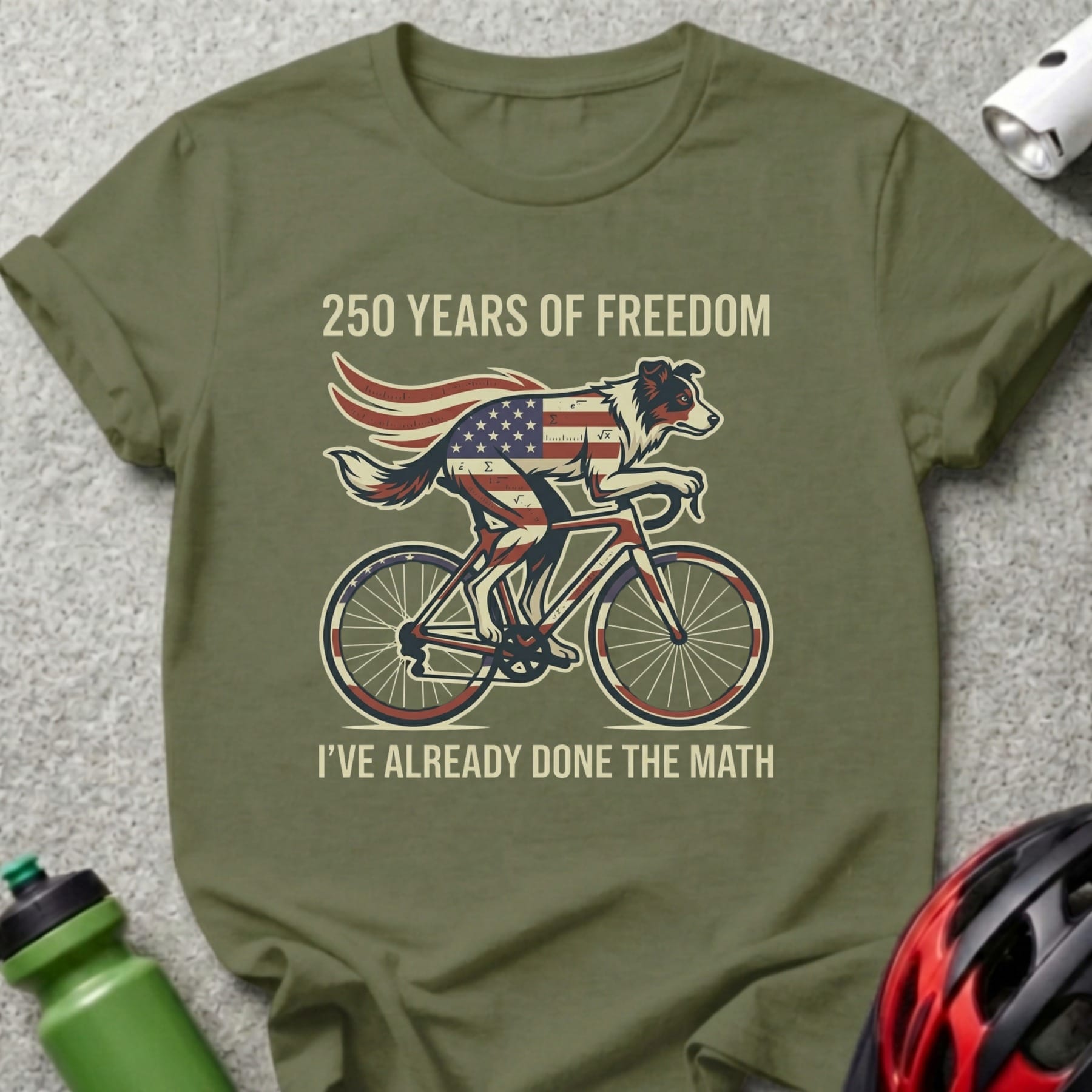 Green t-shirt with dog on bicycle and "250 Years of Freedom" text.