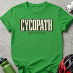 Green t-shirt with "CYCOPATH noun. see: cyclist." text and cycling gear.