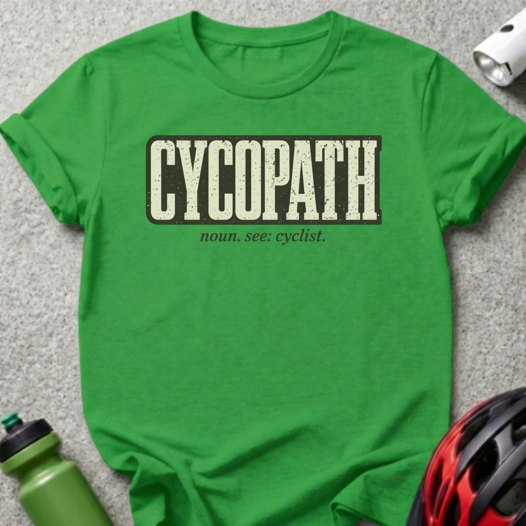 Green t-shirt with "CYCOPATH noun. see: cyclist." text and cycling gear.
