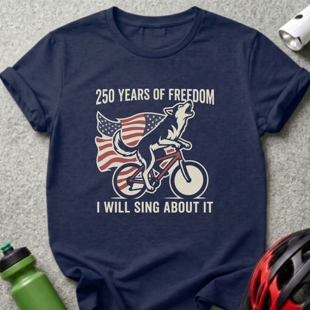 Wolf on bicycle with American flag, "250 Years of Freedom I Will Sing About It".