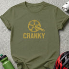 Olive t-shirt with gold glittery bicycle crank and the word CRANKY.