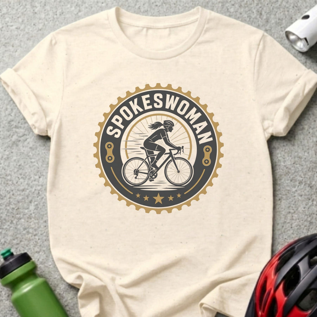 T-shirt with "Spokeswoman" logo featuring a cyclist and gear motif.