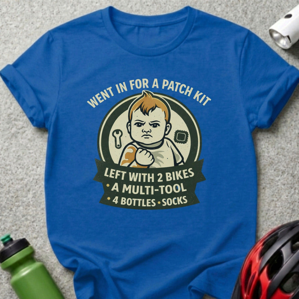 T-shirt with graphic of baby, text "Went in for a patch kit, left with 2 bikes."