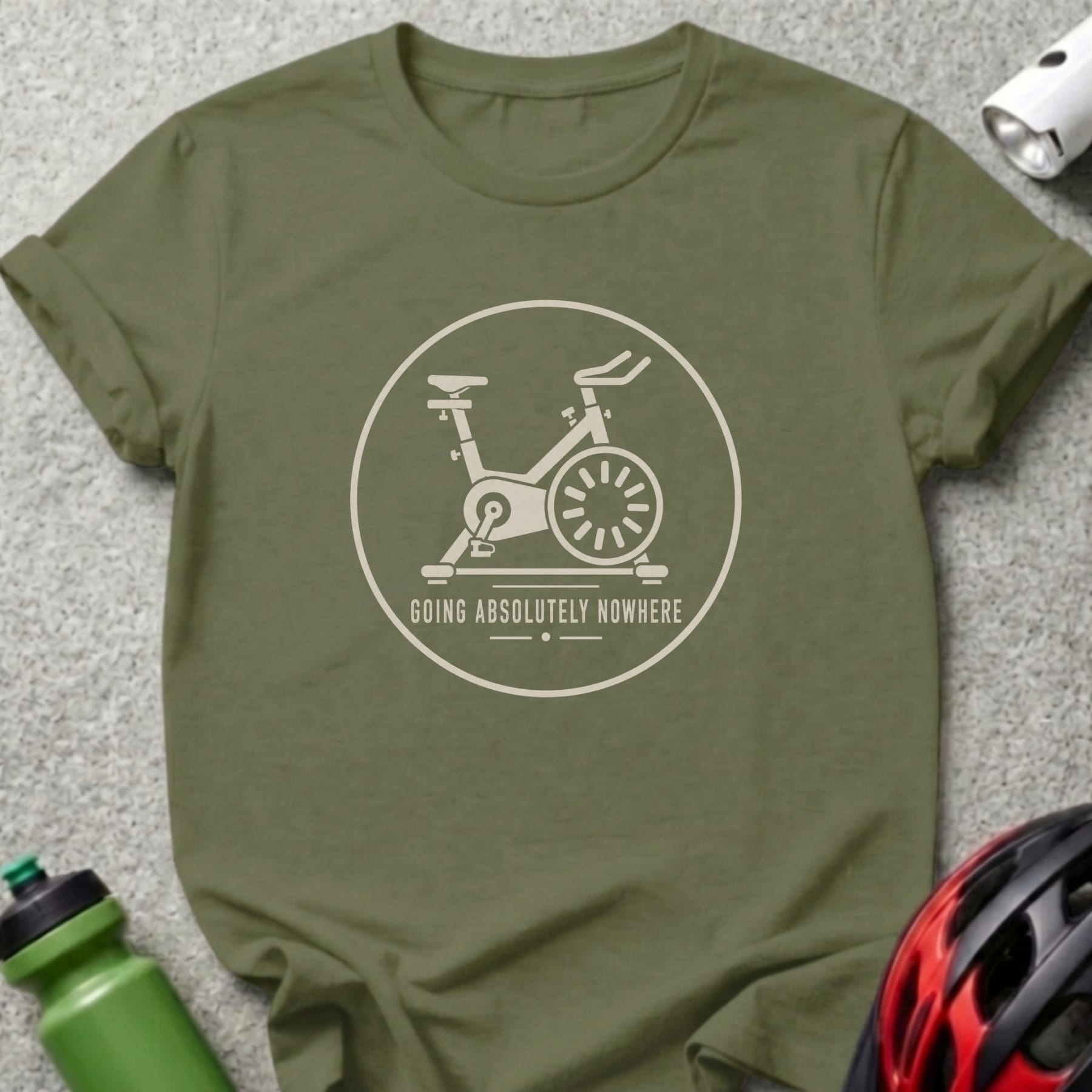 T-shirt with a graphic of a stationary bicycle and the text "GOING ABSOLUTELY NOWHERE".