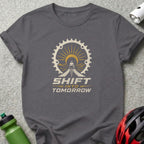 Gray t-shirt with "Shift Into Tomorrow" text and cyclist graphic inside a gear.