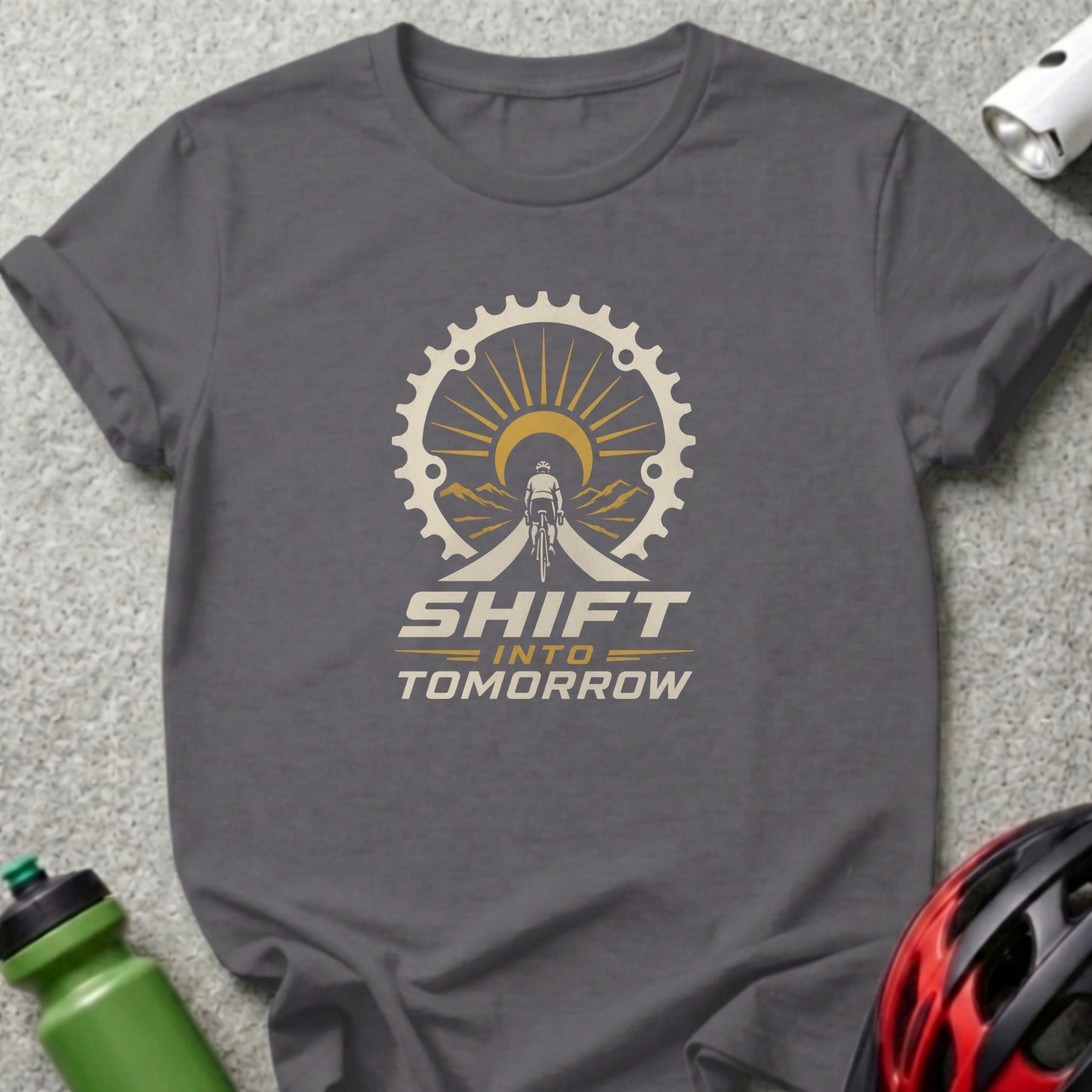 Gray t-shirt with "Shift Into Tomorrow" text and cyclist graphic inside a gear.
