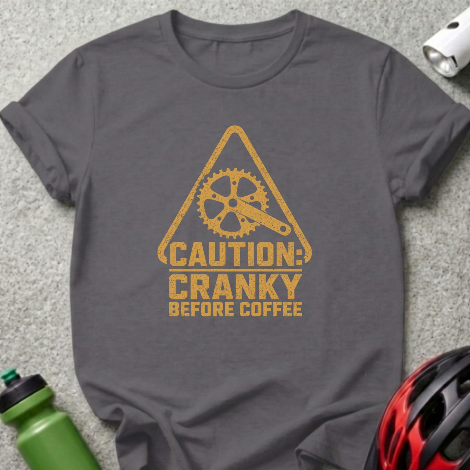 Dark grey t-shirt with yellow graphic: "CAUTION: CRANKY BEFORE COFFEE"