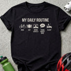 Black t-shirt with "MY DAILY ROUTINE" and icons for cycling, eating, work, thinking, and sleeping.