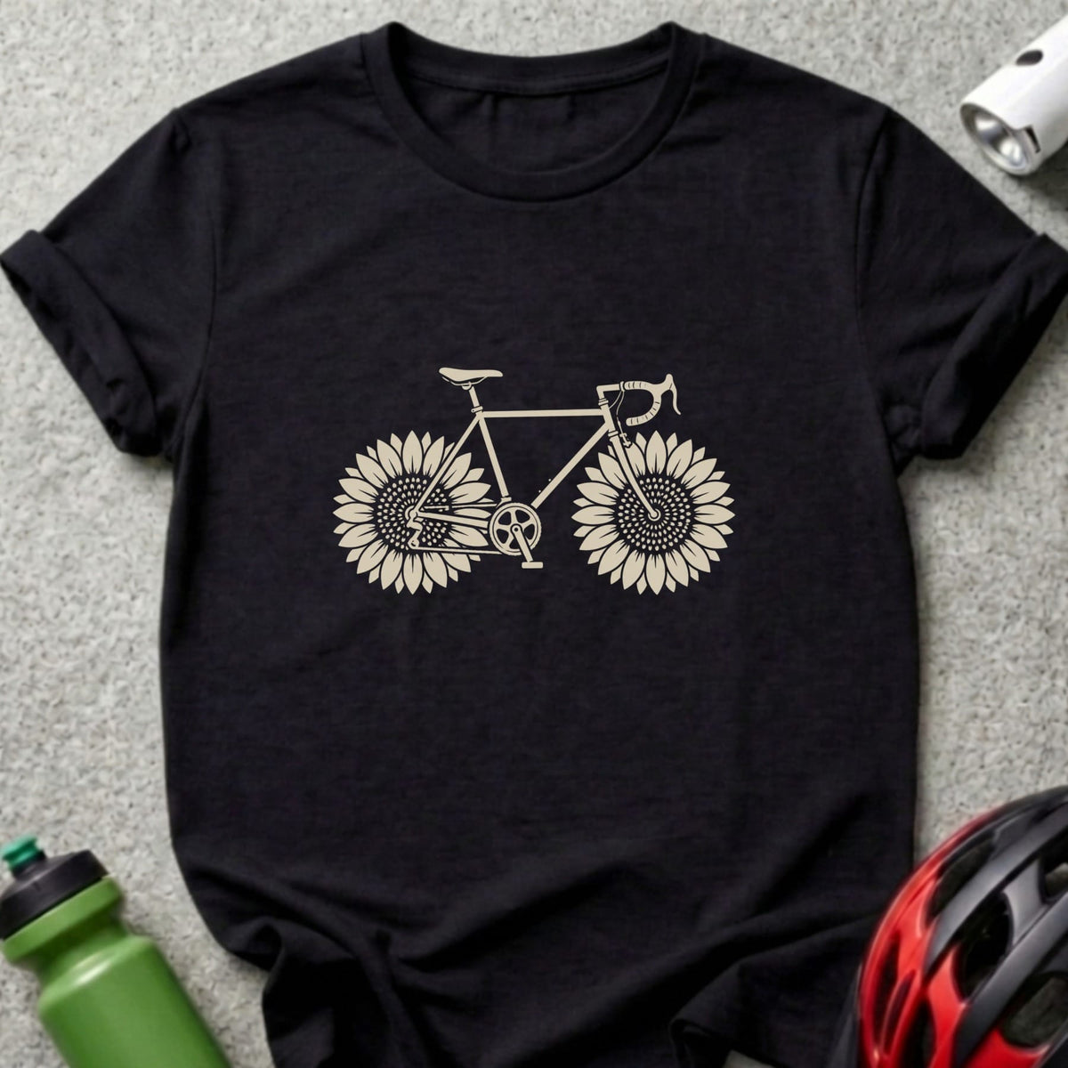A black crewneck t-shirt featuring a beige graphic of a bicycle with sunflowers as wheels.