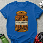 Blue t-shirt with a jar of "Antidepressants: Cycling & Dogs" filled with bicycles and dogs.