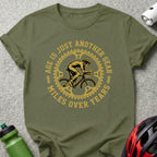 Cyclist graphic with text "Age is just another gear, miles over years" on a green t-shirt.