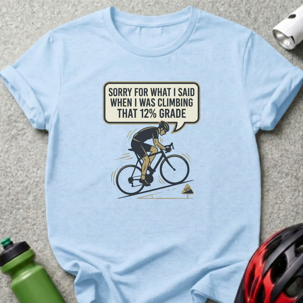 T-shirt with cyclist graphic and text "Sorry for what I said when I was climbing that 12% grade."