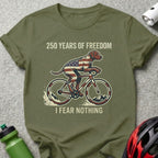 Dog in American flag jersey cycling, with text "250 YEARS OF FREEDOM I FEAR NOTHING".