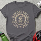 Gray t-shirt with circular graphic: "NEVER TOO OLD TO RIDE EST. ON TWO WHEELS"