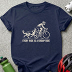 A dark blue t-shirt with a white graphic of a cyclist and dog, featuring the text "EVERY RIDE IS A GROUP RIDE".