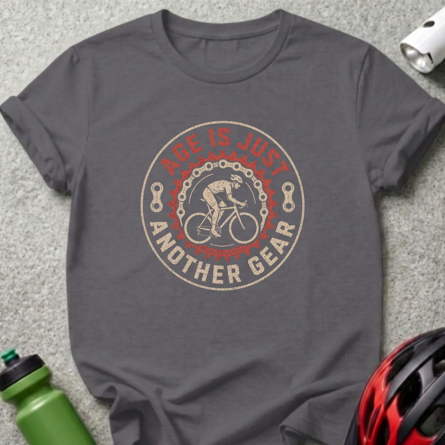 Gray t-shirt with circular graphic: "AGE IS JUST ANOTHER GEAR" and cyclist.