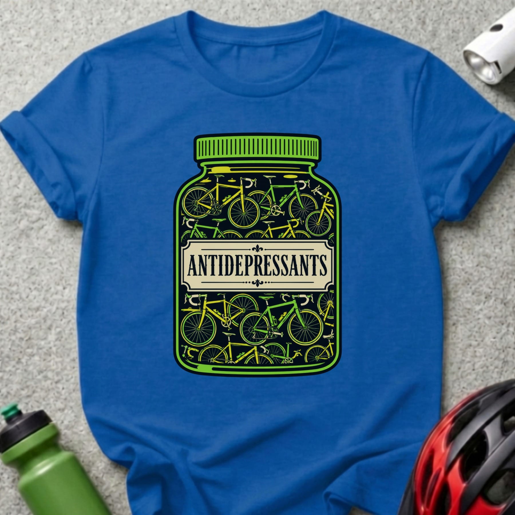 Blue t-shirt with a graphic of bicycles inside a pill bottle labeled "ANTIDEPRESSANTS".
