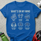 Blue t-shirt with graphics illustrating six thoughts about a bicycle.