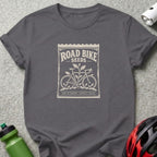 A dark gray crewneck t-shirt featuring a vintage seed packet graphic with text reading ROAD BIKE SEEDS.