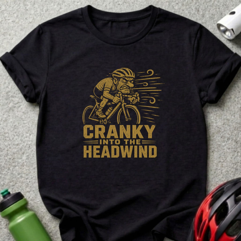 Black t-shirt with a graphic of a cyclist and text "CRANKY INTO THE HEADWIND".