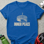 A royal blue t-shirt printed with a graphic of a rolled bicycle inner tube and the text INNER PEACE.