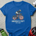 Blue t-shirt with cyclist graphic celebrating America's 250th anniversary.