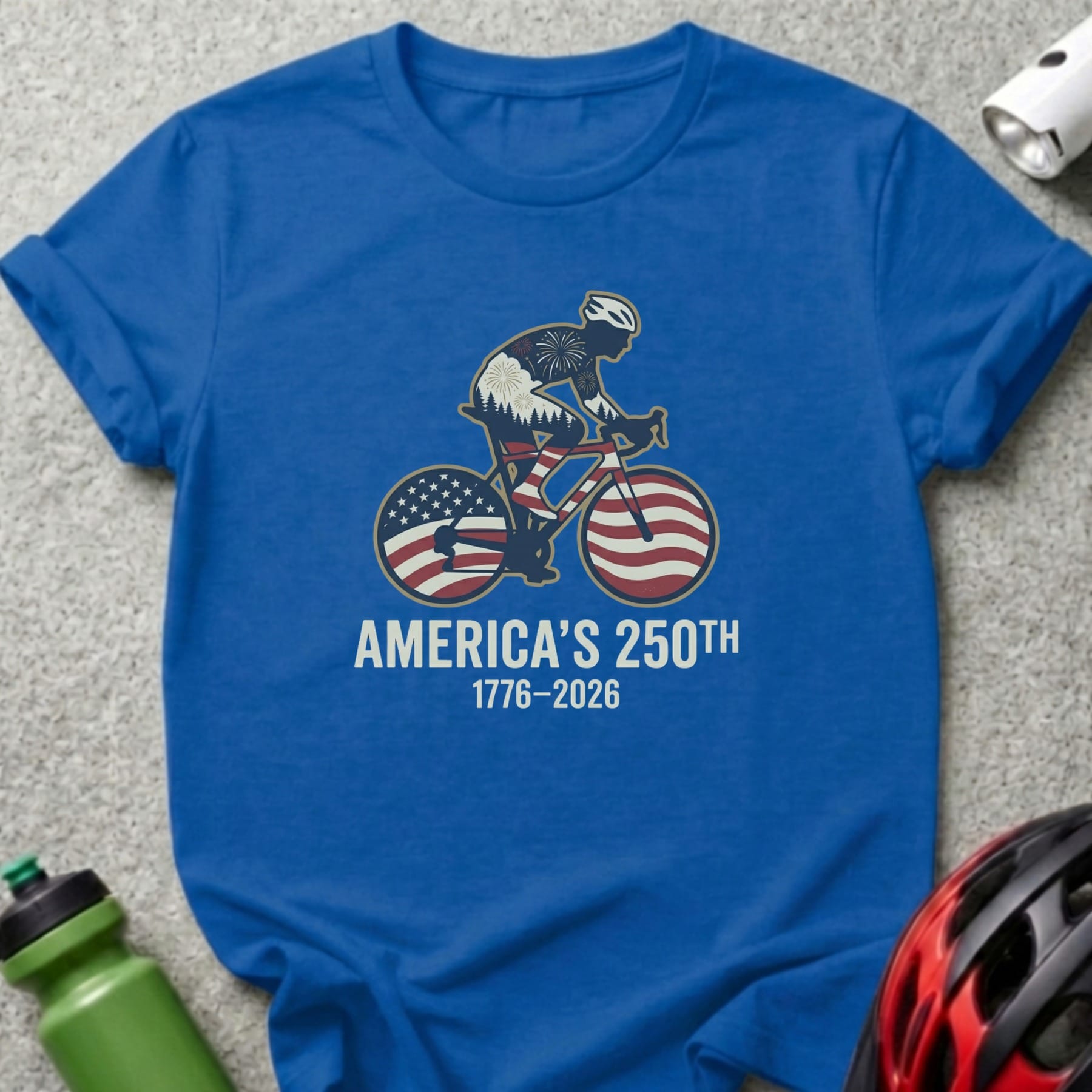 Blue t-shirt with cyclist graphic celebrating America's 250th anniversary.