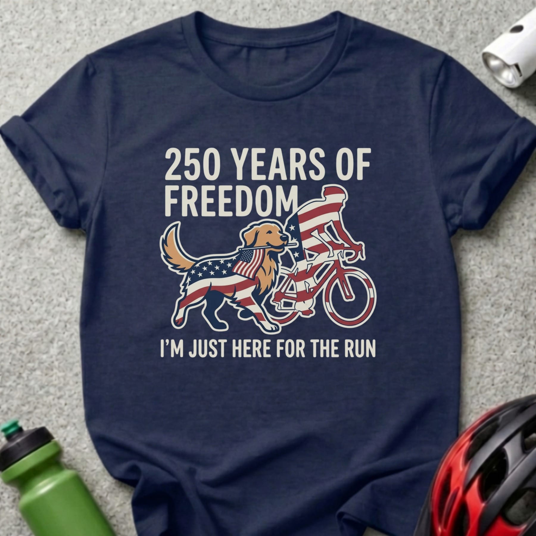 Navy t-shirt with dog on bike, American flag design, and text.