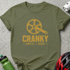 Olive green t-shirt with yellow graphic of a crankset and "CRANKY UNTIL I RIDE" text.