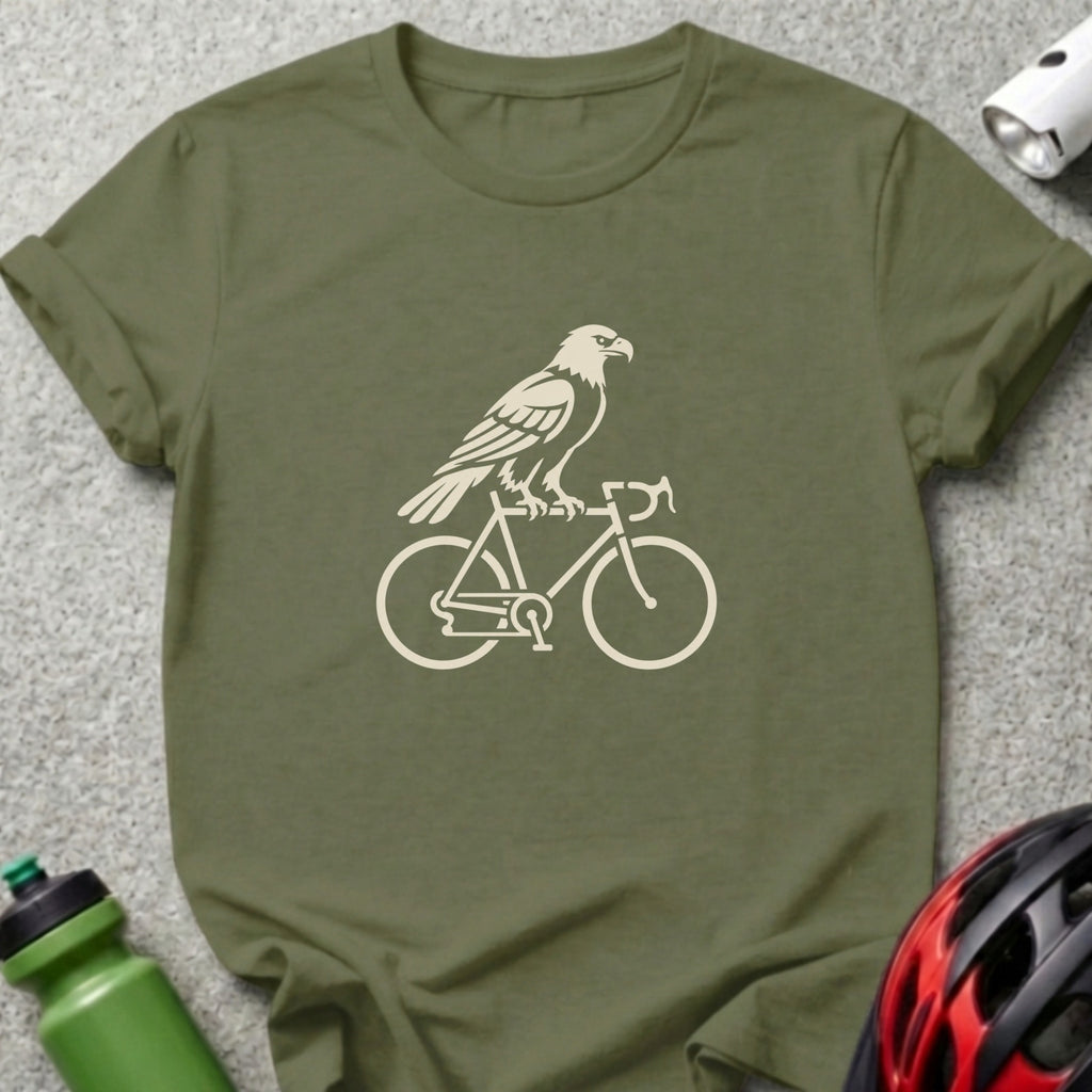 An olive green t-shirt featuring a cream-colored graphic of an eagle perched on a bicycle.