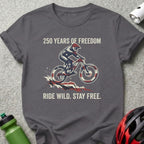 Dark grey t-shirt with "250 Years of Freedom Ride Wild. Stay Free." text and cyclist graphic.